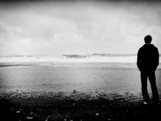 man alone on beach